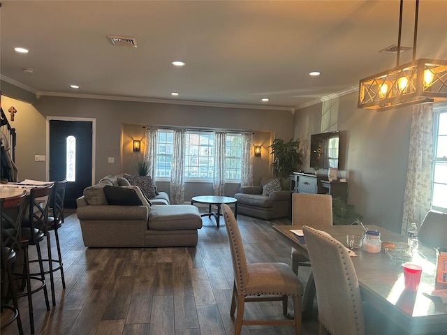 living room featuring dark hardwood / wood-style floors and crown molding