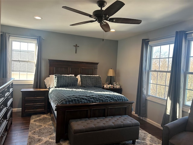 bedroom with ceiling fan and dark hardwood / wood-style flooring