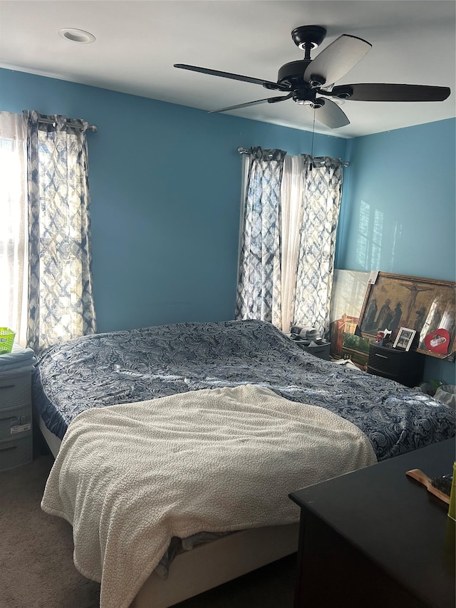 bedroom featuring ceiling fan and carpet floors