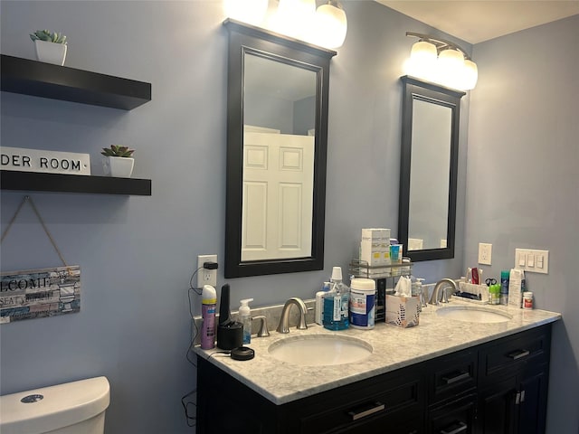 bathroom featuring vanity and toilet