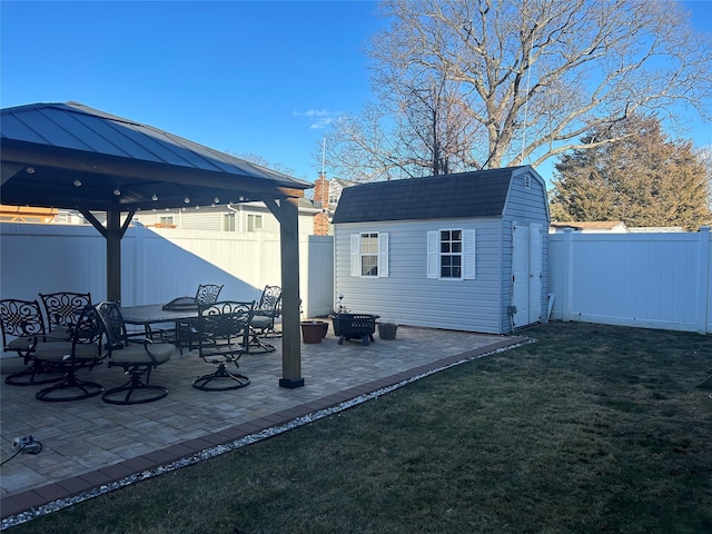 exterior space with a gazebo and a storage unit