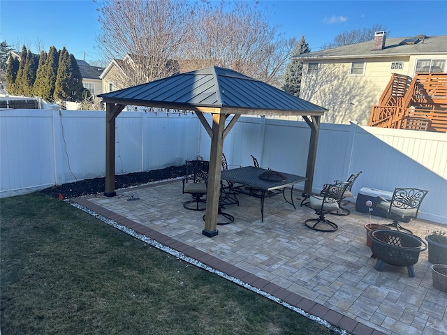 view of patio with a gazebo and an outdoor fire pit