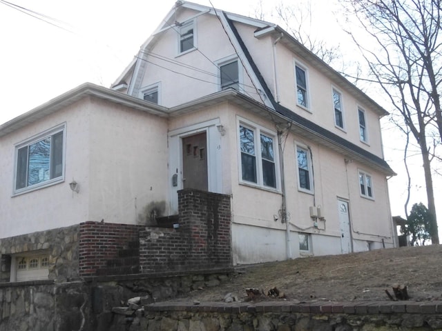 view of side of property featuring a garage