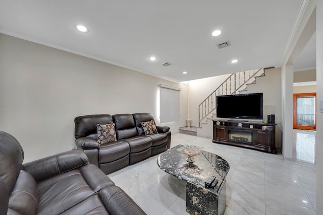 living room with ornamental molding