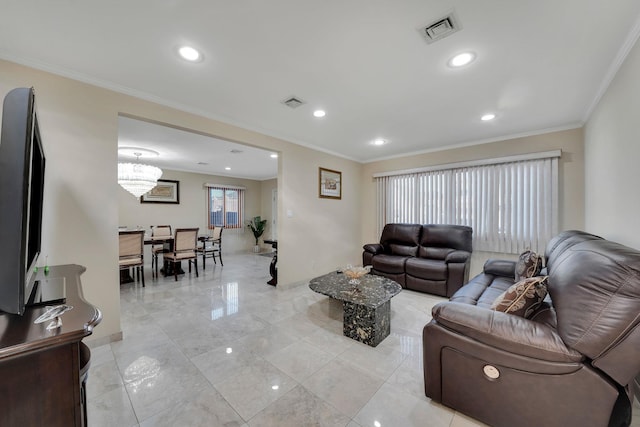 living room featuring an inviting chandelier and ornamental molding