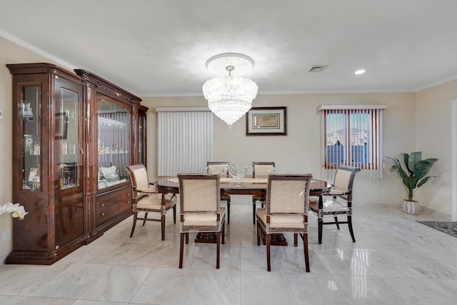 dining room with an inviting chandelier and crown molding