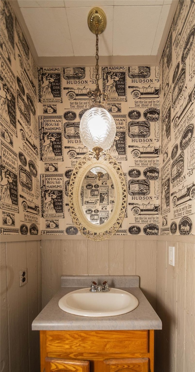 bathroom with tasteful backsplash and vanity