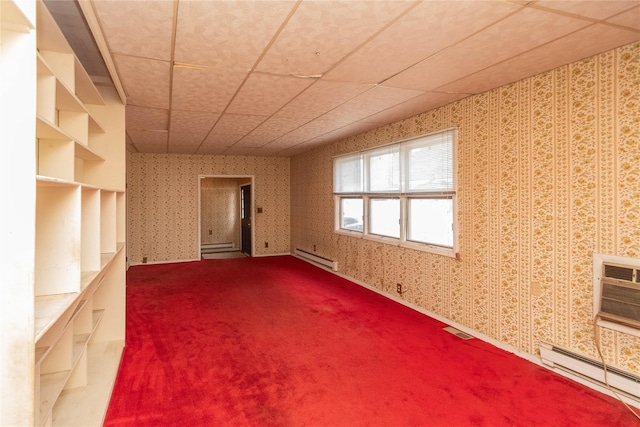 unfurnished room with carpet flooring and a baseboard radiator