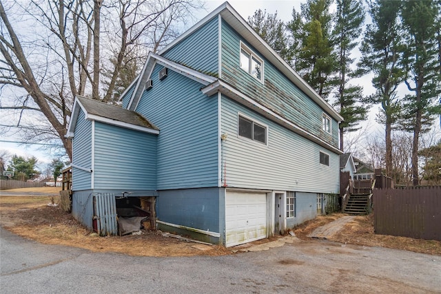 view of side of property with a garage