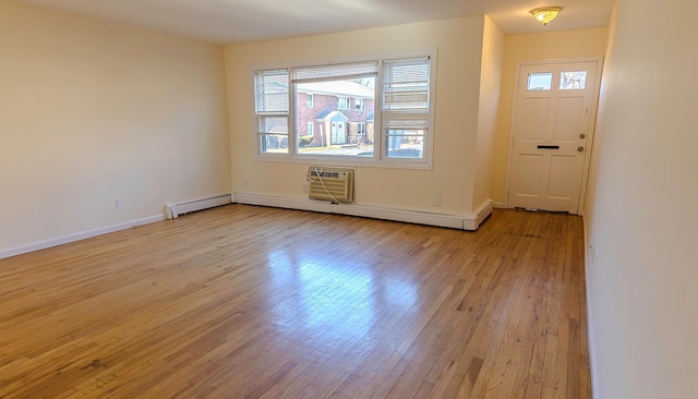 entryway with light hardwood / wood-style flooring and a wall mounted air conditioner