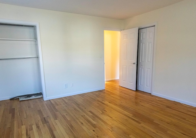 unfurnished bedroom featuring light wood-type flooring