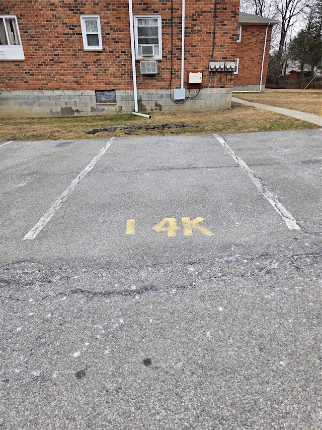 view of parking / parking lot featuring cooling unit