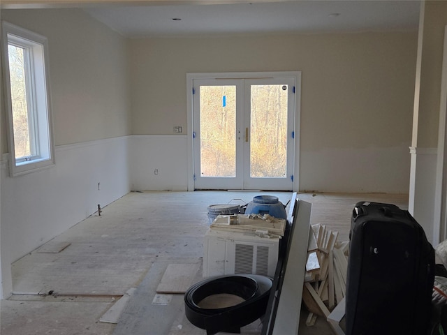 spare room featuring french doors and a wealth of natural light