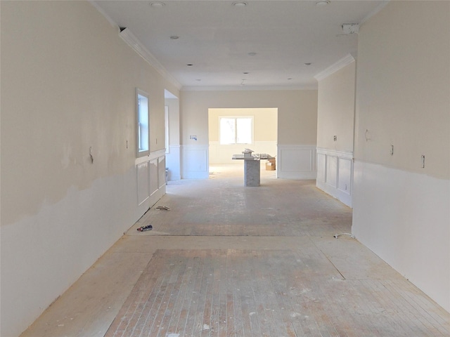 empty room featuring crown molding