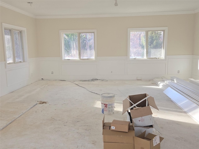 unfurnished room with crown molding