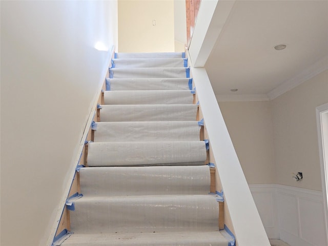 stairway with crown molding