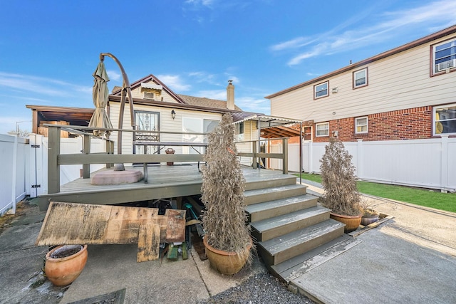 back of property featuring a wooden deck