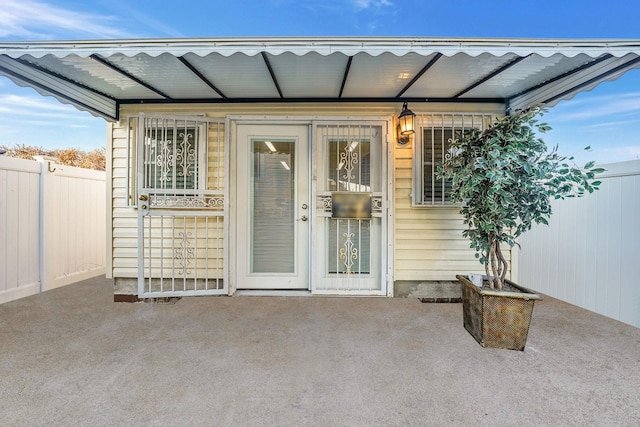 property entrance featuring a patio