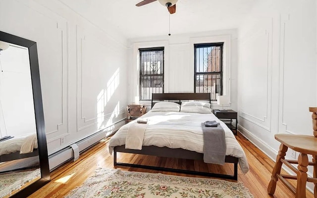 bedroom featuring ceiling fan and light hardwood / wood-style floors