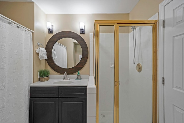 bathroom featuring vanity and a shower with shower door