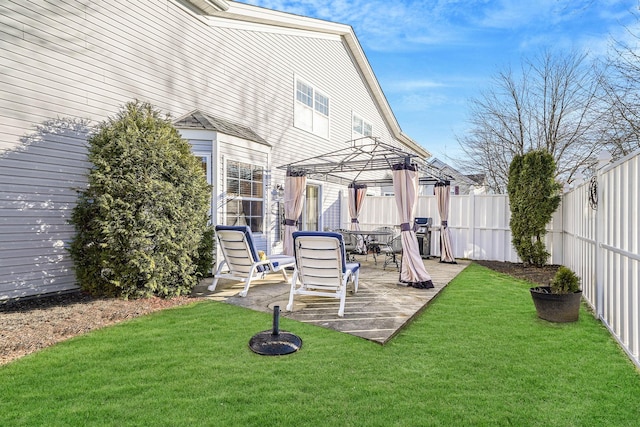 back of house with a lawn, a gazebo, and a patio