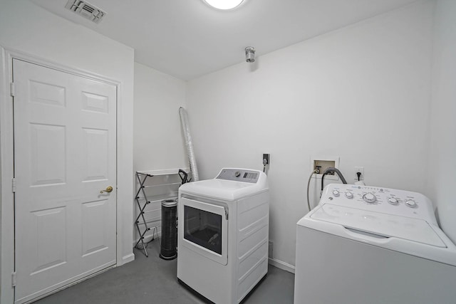 washroom featuring washer and clothes dryer