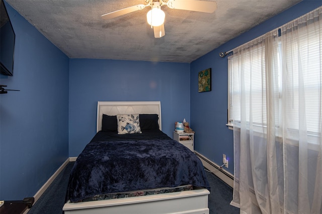 unfurnished bedroom with ceiling fan and baseboard heating