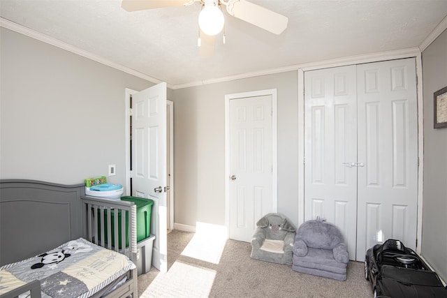 carpeted bedroom featuring ceiling fan and ornamental molding