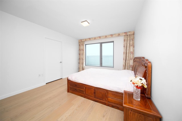 bedroom featuring light wood-type flooring