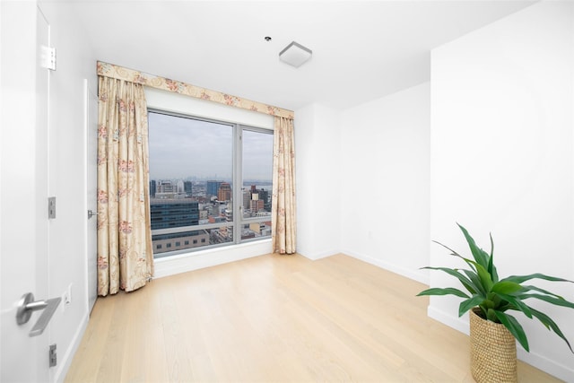 spare room featuring hardwood / wood-style floors