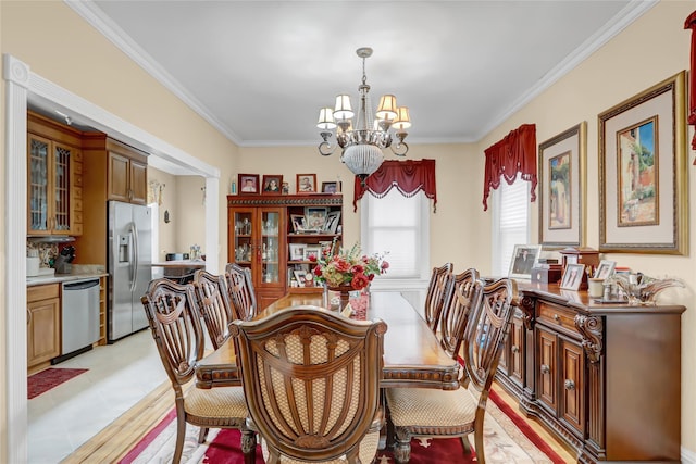 dining space featuring ornamental molding and a chandelier