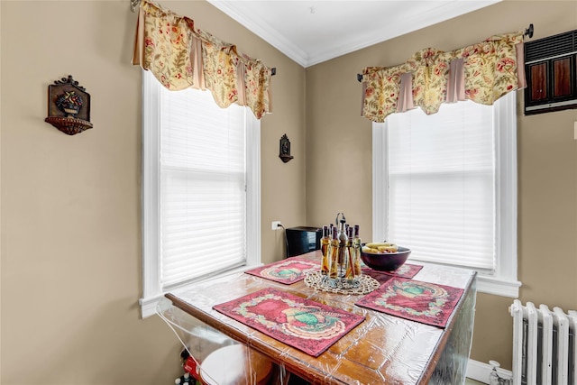 dining area featuring radiator and ornamental molding