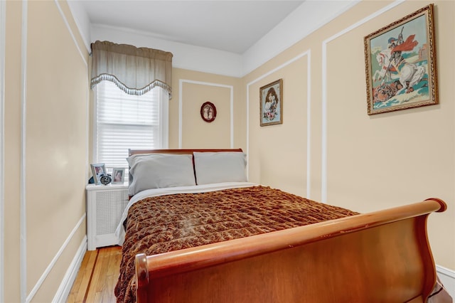 bedroom with light hardwood / wood-style flooring