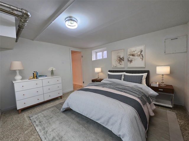 bedroom with baseboards and carpet floors