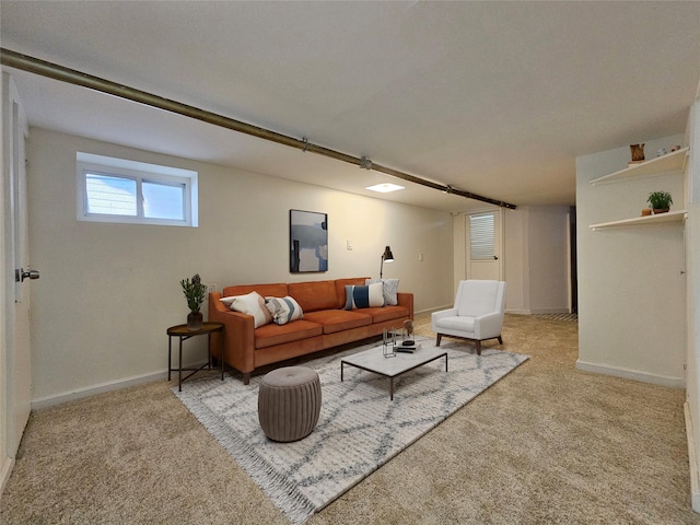 carpeted living room featuring baseboards