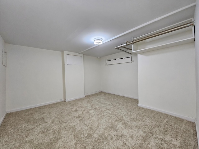 walk in closet with carpet flooring