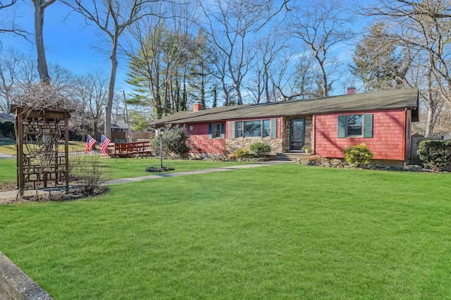 single story home with a playground and a front yard