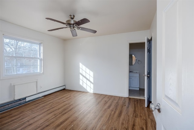 unfurnished room with baseboard heating, ceiling fan, and hardwood / wood-style floors