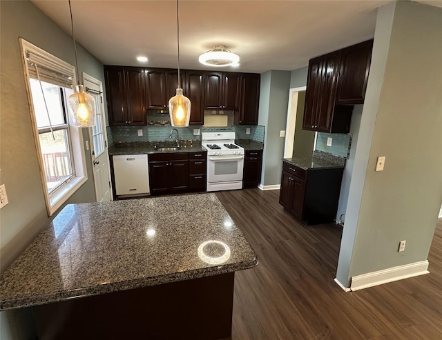 kitchen featuring dark hardwood / wood-style floors, white appliances, dark brown cabinets, hanging light fixtures, and sink