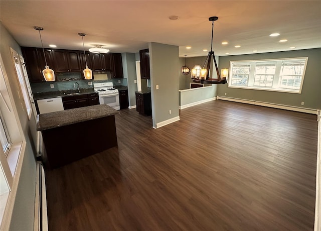 kitchen featuring a baseboard heating unit, white appliances, dark brown cabinets, pendant lighting, and sink