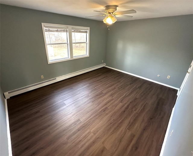 unfurnished room featuring a baseboard heating unit, ceiling fan, and dark hardwood / wood-style floors