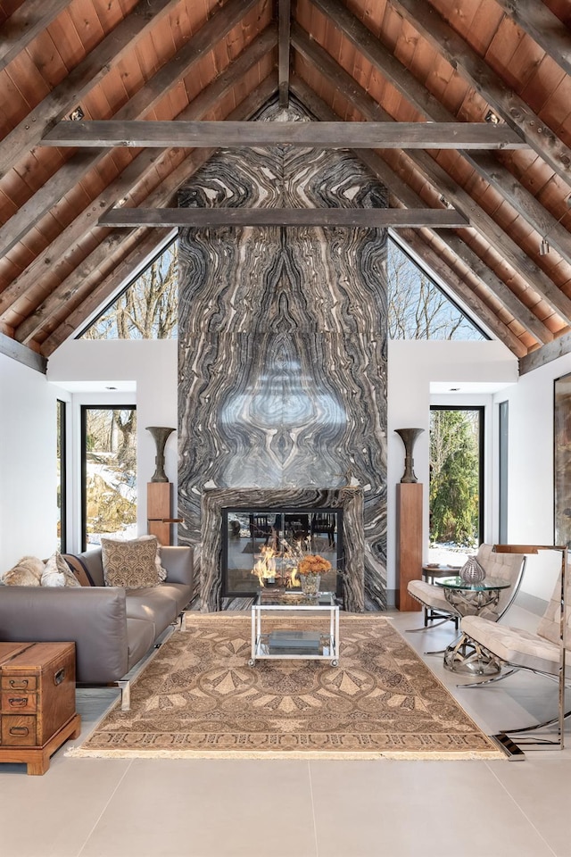 living room with high vaulted ceiling, a fireplace, wood ceiling, and beam ceiling