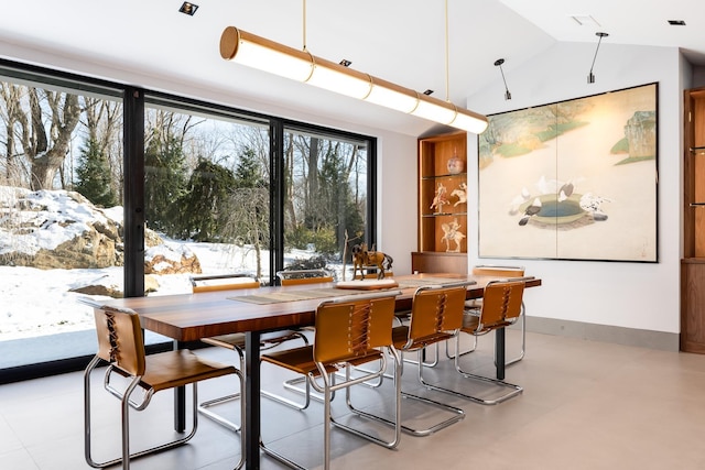 dining room with lofted ceiling