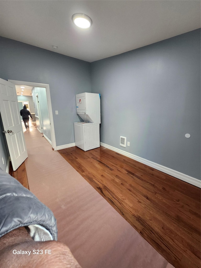 bedroom with hardwood / wood-style floors