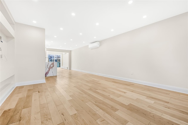 interior space featuring light hardwood / wood-style flooring and a wall mounted AC