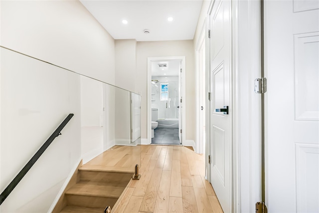 corridor with light wood-type flooring