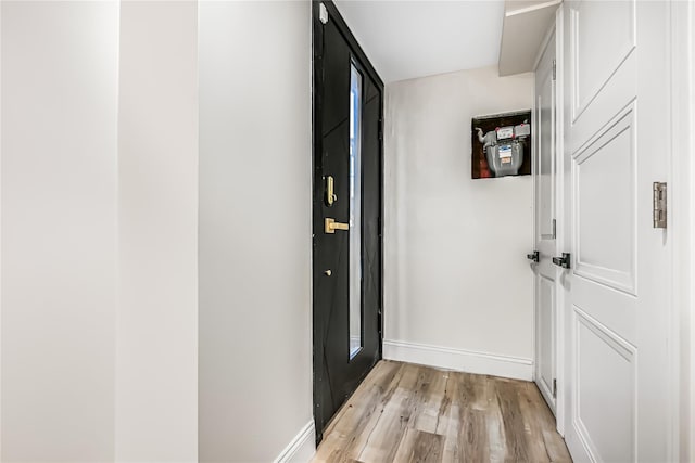 hall with light hardwood / wood-style flooring