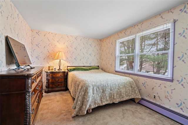 bedroom featuring light carpet and a baseboard radiator