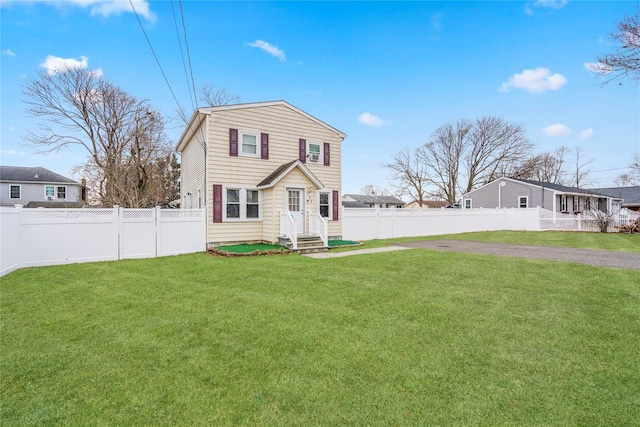 view of front of home with a front yard