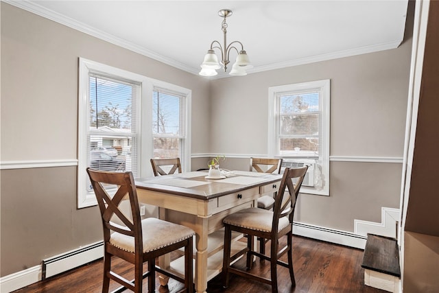 dining space with crown molding, dark wood-type flooring, a baseboard radiator, and a notable chandelier